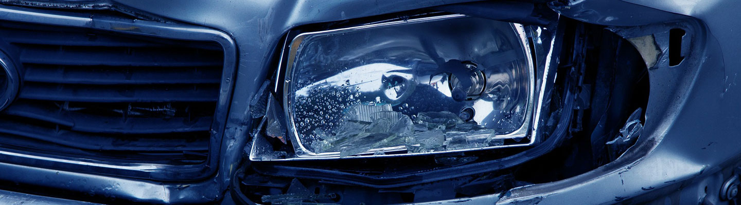 Image of a car's broken headlight, representing how auto parts can be defective.